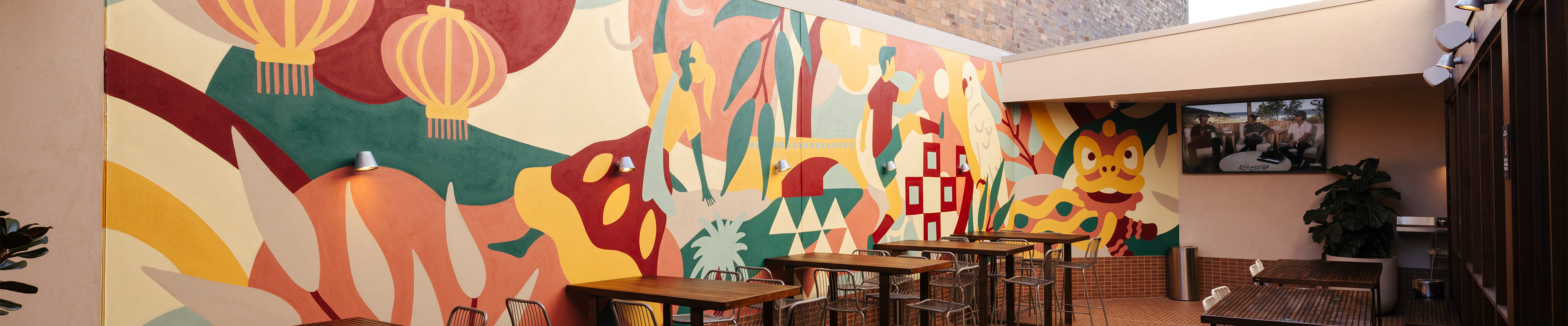 Vibrant mural decorates bar wall.