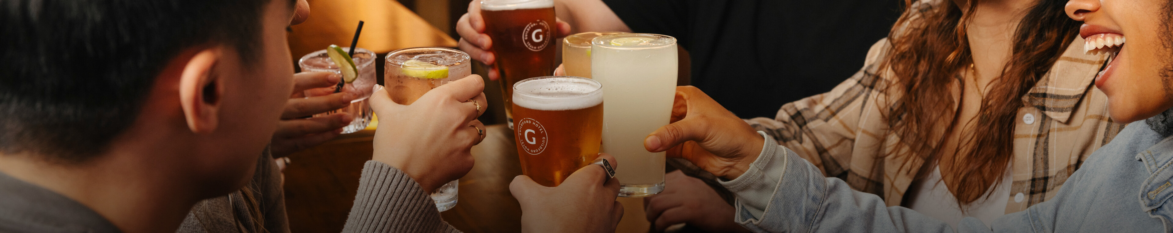 a group of friends clinking glasses