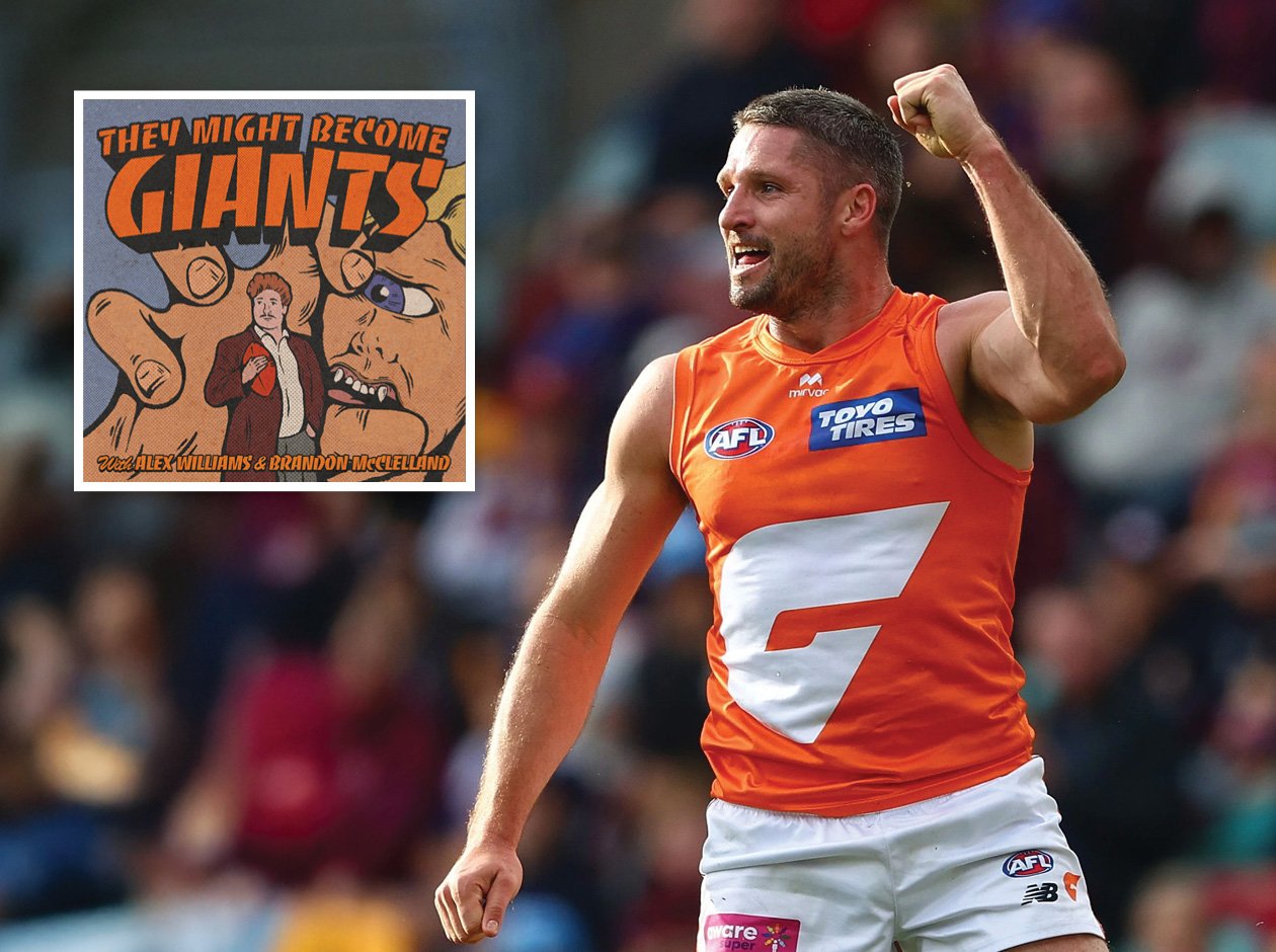 a Giants player celebrating with a clenched fist in the air