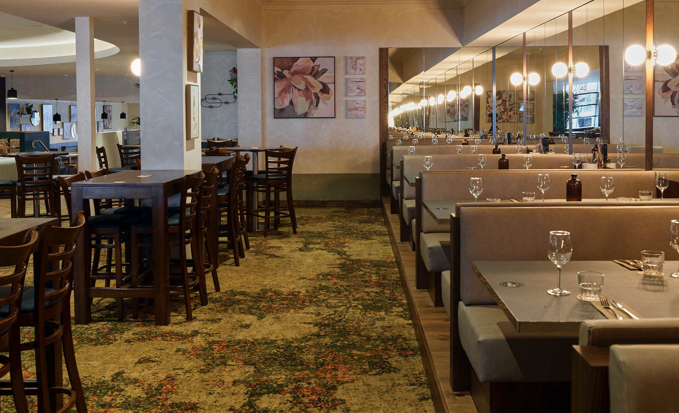 lounge bar with booth seating and high bar tables and chairs