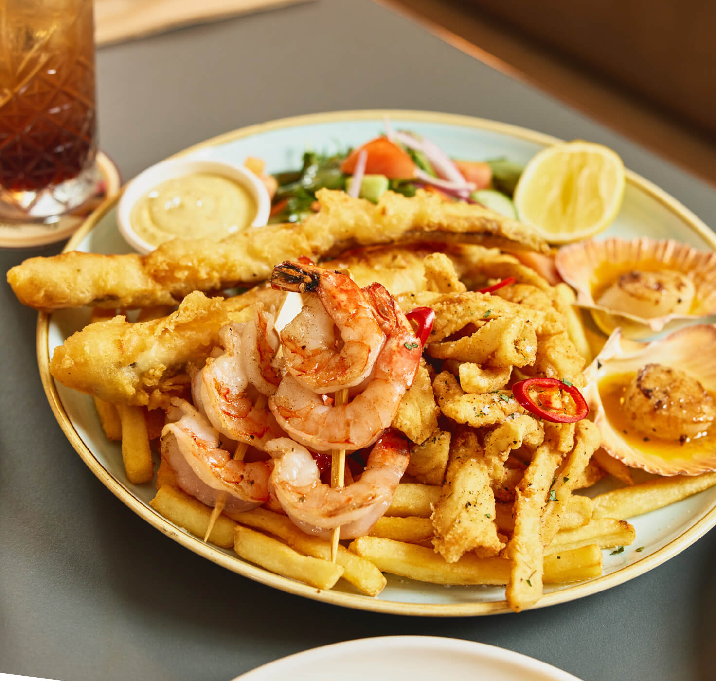 a seafood platter with chips